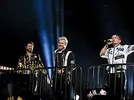 Take That performing in 2017. From left to right: Howard Donald, Gary Barlow and Mark Owen.
