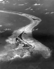 Aerial view of Betio Island, Tarawa Atoll before invasion of the island by U.S. Marines, 18 September 1943. The image was shot by an aircraft from Composite Squadron (VC) 24.
