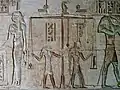 Meskhenet as a birth brick depicted above the scales in a Weighing of the Heart scene in Ptolemaic temple at Deir el-Medina