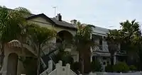 Combinations of Victorian terraces and late Edwardian duplexes and a variety of subtropical palms