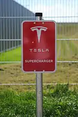 Tesla logo at a Supercharger station in Germany