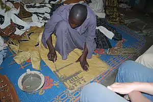 Image 4A textile artisan at work in Djenne, Mali. (from Culture of Mali)