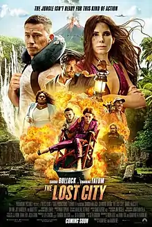 A man and a woman standing shoulder to shoulder. In the distance an active volcano. An explosion fills the foreground and the man is carrying the woman in a wheelbarrow.