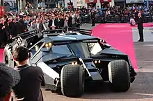 A photograph of Batman's vehicle, the Tumbler, among a crowd at the European premiere of The Dark Knight in London