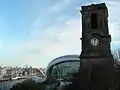 Church in front of building.