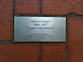 Metal plaque set in brick pavers