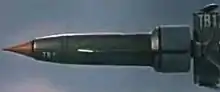 A rocket plane with pointed nose cone and tail engine block