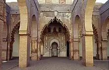 View towards the mihrab area of the mosque, with different types of arches setting apart the aisle running along the southern wall of the mosque