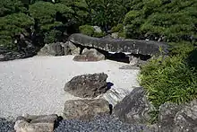 A bridge at Tokushima castle made of two stones resting on a third stone (1592).