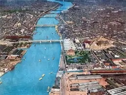 An aerial view of the Sumida River with Taitō-ku (west) and Sumida-ku (east) in Tokyo, c.&nbsp;1930