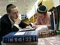 A Torat Shraga Rabbi learning with a student