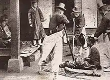 It is a picture in Joseon period with some staff whipping the criminal