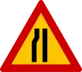 K-6αRoad narrows on left