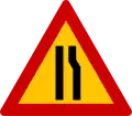 K-6δRoad narrows on right