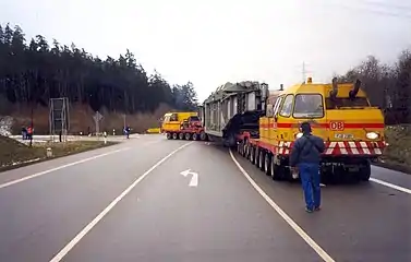 Onward transportation of the large transformer by road to the electricity substation.