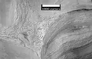 Apparent viscous flow features on the floor of Hellas, as seen by HiRISE.