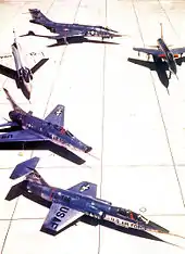Five aircraft parked on ramp for black-and-white photo shoot