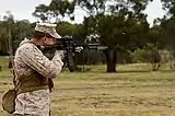 M9 bayonet fitted M4 carbine firing during secondary target drills.