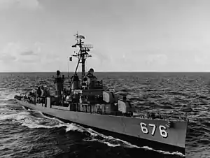 USS Marshall (DD-676), pulling alongside USS Coral Sea (CVA-43), during refueling exercises off the California coast, 7 March 1963.