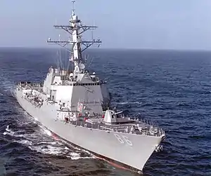 A grey ship on the ocean.