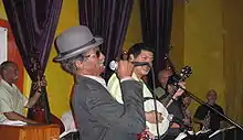 "Uncle" Lionel Batiste (in derby hat) with  "Papa" Don Vappie (with banjo)