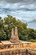 Two pillars standing alone near the temple.