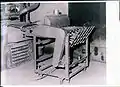 Morandi's Automatic machine for collecting into a pile ceramic tiles from the pressed one