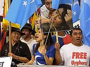 Protesters with Kökbayraq flag in front of the UN building in New York City