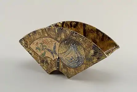 Faience or earthenware vase with two feet, with mountain night scene on the back and a floral daylight scene with butterfly on the front.(1884-1885)