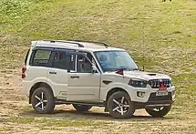 Mahindra Scorpio  entitled to Champhai Deputy Commissioner, India. Note the red traingualr "DC" flag, the designation plate reading "DC CHamphai" and the radio antenna.