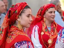 Women from Viana do Castelo wearing traditional Portuguese dresses[321][322].