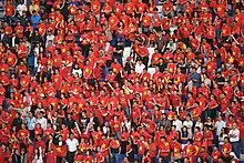 Supporters of the Vietnam national football team wearing attire that is visually inspired by the National Flag in the 2019 AFC Asian Cup.