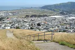 Visitacion Valley viewed from Visitacion Ave is Mansell St by John McLaren Park.