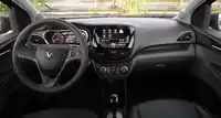  Dashboard of left-hand-drive car with automatic gearbox, rotary heating controls, and an inbuilt satellite navigation screen