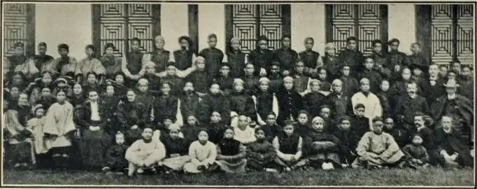 The visit of the deputation to Tungchwan in 1904, photographed outside the Meeting House. The three Members of the deputation, together with Isaac Mason and Edward B. Vardon, may be seen on the extreme right; Dr. Lucy Harris on the extreme left; and, nearer the centre, Esther L. Mason and Mira L. Cumber.