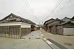 Wooden and black tile-roofed ship-owner houses.
