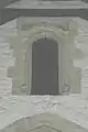 Door to 17th century tower, above the tower arch and just under the nave roof