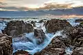 Image 6Waves on rocks at sunset in Sète, France