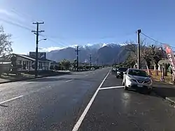 State Highway&nbsp;6 running through Whataroa, with Mount Adams in the background