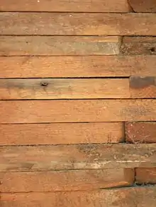 Stacked plank construction in Wildfell, a historic home in Darlington, Maryland. Stacked board construction is similar but with thinner lumber.