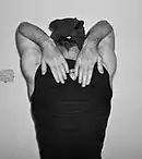 Hands Placed on Respective Shoulder Blades