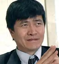 Head and shoulders photo of Zhou Fengsuo