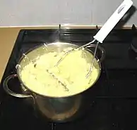 Dutch zuurkoolstamppot includes sauerkraut mashed with potatoes and is traditionally served with rookworst