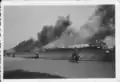 Statendam (III) burning (seen at the far left) with the SS Veendam (seen at the right)