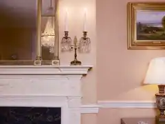View of Washington, D.C. by Andrew W. Melrose hangs in the Dining Room