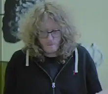 A white man with blond hair