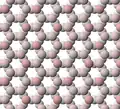 View of tetrahedral sheet structure of talc. The apical oxygen ions are tinted pink.