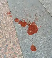 Chewing betelnut produces a red residue, which is spat out.