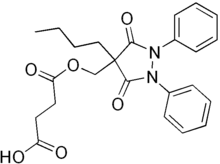 Two-dimensional monochrome diagram showing the structure of the molecule of Suxibuzone, uing the hexagonal style to depict a chemical compound.