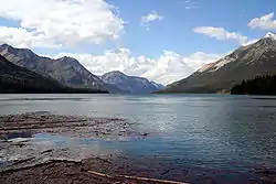 A lake in front of mountains